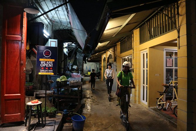 Bangkok at Night by Electric Scooter - Wat Arun shimmering at night, plus a local ferry start