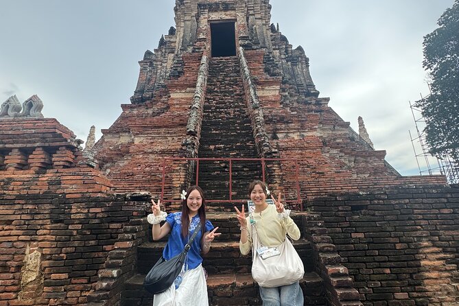 Bangkok to Ayutthaya: Temples & Local Candy One Day Tour - Wat Mahathat and the iconic Buddha head in roots