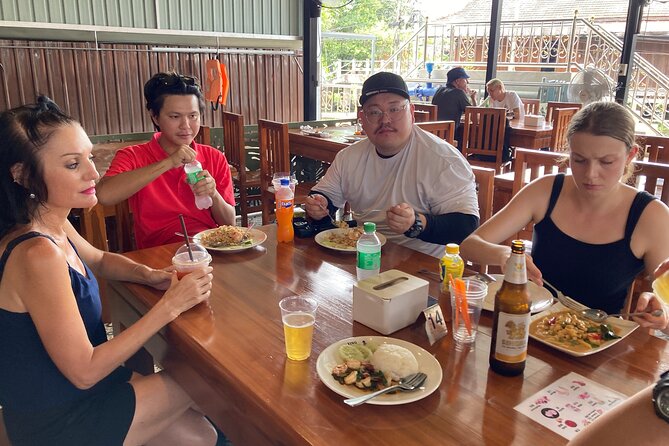 Damnoen Saduak and Maeklong Railway Market Tour with Private Car - The Maeklong Railway Market moment: see the stalls fold in real time