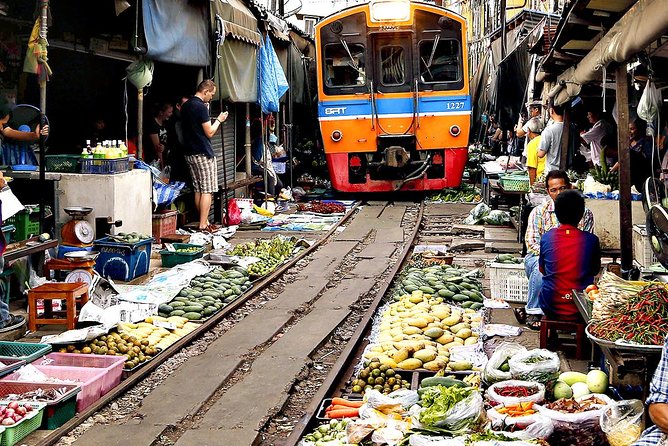 Famous Markets Tour: Maeklong Railway & Damnoen Saduak Floating - Damnoen Saduak Floating Market: Produce, boats, and a canal economy