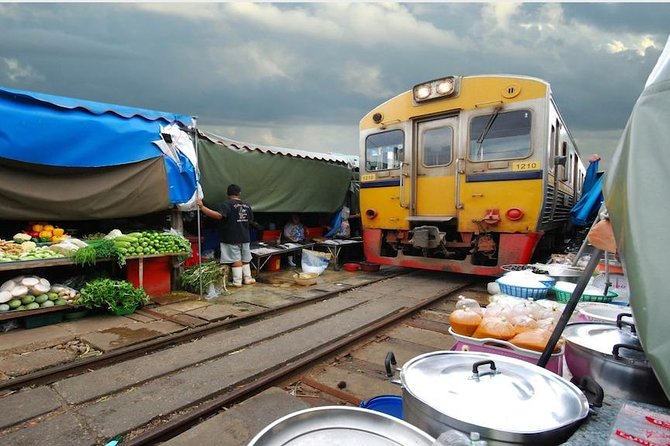 Maeklong & Damnoen Saduak Markets: Railway & Floating Market Tour - Maeklong Railway Market: Watching a Market Make Space for a Train