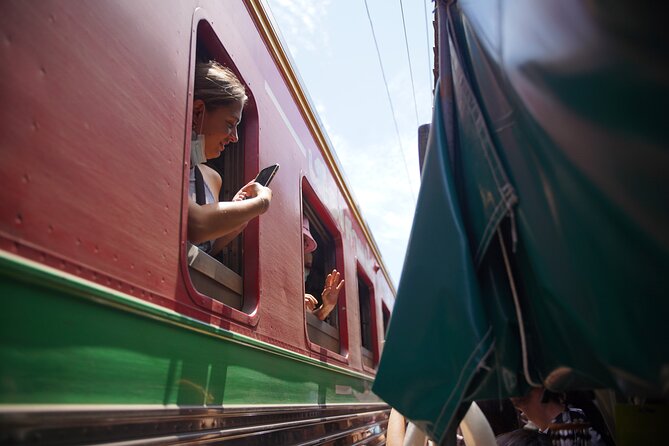 Maeklong Railway Market and Floating Market - Stop 1: Mae Klong Railway Market (Hoop Rom) and the track-level train moment