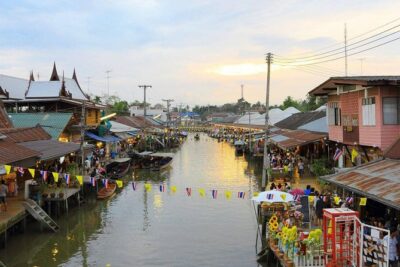 Maeklong Railway Market and Floating Market Tour from Bangkok - Maeklong Railway Market: Umbrellas Pull Down, Trains Roll In