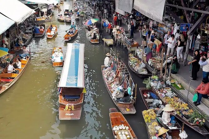 Private Damnoen Saduak and Maeklong Railway Market Tour(min 2pax) - Maeklong Railway Market: the train that stops the market