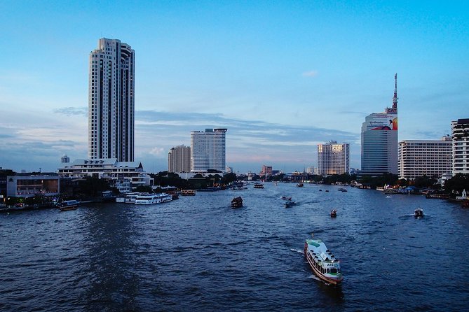 The White Orchid River Dinner Cruise Experience - Landmark Views From the River: Grand Palace, Wat Arun, and More