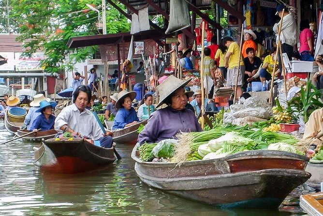 Unique Bangkok Markets: Train Market & Floating Market Adventure - Maeklong Railway Market: umbrella pulldown chaos on the tracks